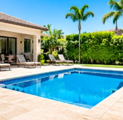 Before: rectangular pool beside a covered patio without a fence
